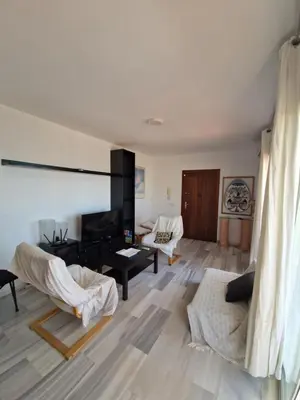 Zona de estar de Bonito ático con vistas al mar