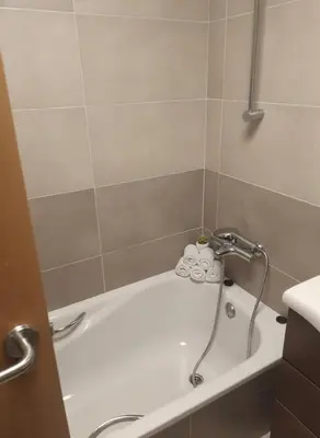 Un baño de Roquetas Del Sol, Pools & Gym