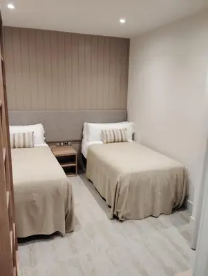 Cama o camas de una habitación en Hotel Vélez