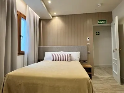 Cama o camas de una habitación en Hotel Vélez