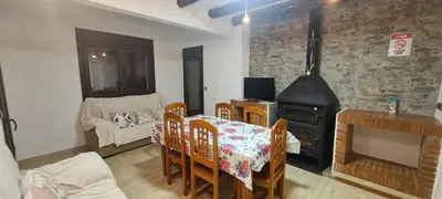 Una televisión o centro de entretenimiento en Casa La cuesta Trevélez