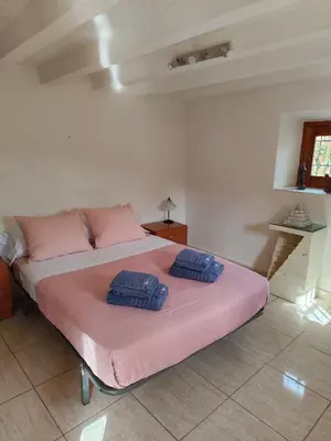 Cama o camas de una habitación en Finca Ana Maria - Maisons d'hôtes rurales avec piscine, au coeur de l'Andalousie et proches de la mer