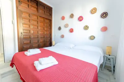Cama o camas de una habitación en La Esquinita, Villa 1ª línea – Puerto Rey