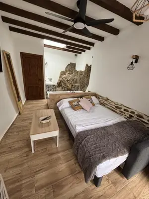 Cama o camas de una habitación en El Tumbao con romántica bañera de hidromasaje para dos