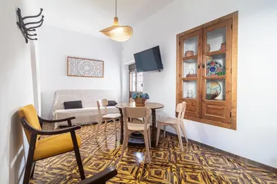 Una televisión o centro de entretenimiento en El Carmen - Villa Rural con Piscina Privada y Patio Andaluz