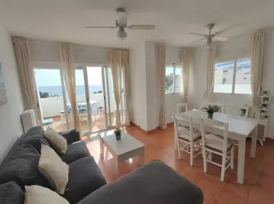Zona de estar de Apartamento en Mojácar Playa con vistas al Mar y Piscina