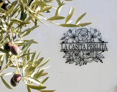 Certificado, premio, señal o documento que está expuesto en La Casita Perlita