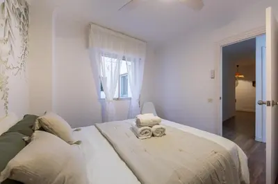 Cama o camas de una habitación en AlmeriaSuite Alcazaba Views