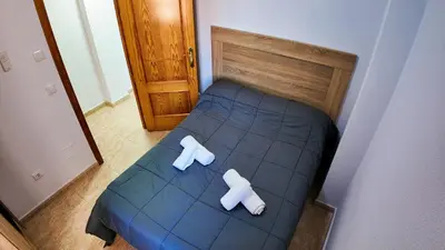 Cama o camas de una habitación en Apartalux Star Magic I