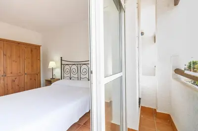 Cama o camas de una habitación en Casa Adosada La Isleta