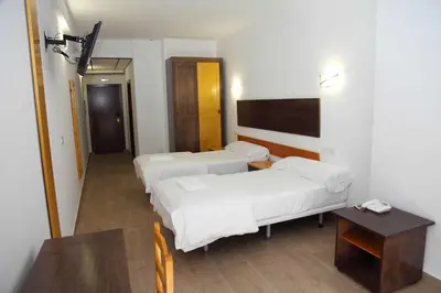 Cama o camas de una habitación en Hotel Lorenzo
