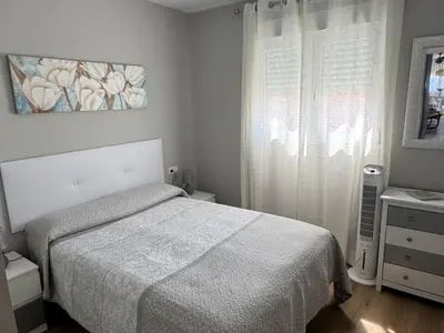 Cama o camas de una habitación en Horizonte Roquetas - Primera Línea de Playa con Vistas al Mar
