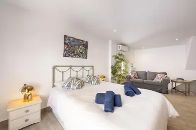 Cama o camas de una habitación en AlmeriaSuite Serenity Stay