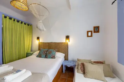 Cama o camas de una habitación en AlmeriaSuite Casita de las Flores