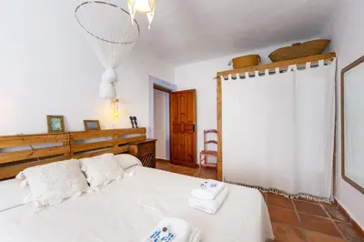 Cama o camas de una habitación en AlmeriaSuite Casita de las Flores
