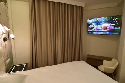 Una televisión o centro de entretenimiento en Resort Villa Las Palmeras