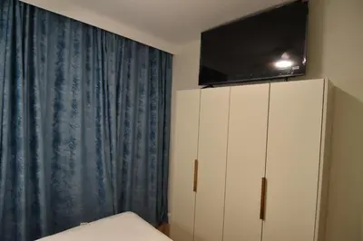 Una televisión o centro de entretenimiento en Resort Villa Las Palmeras