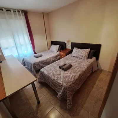Cama o camas de una habitación en Apartamento coqueto con terraza junto al mar