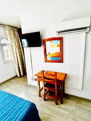 Una televisión o centro de entretenimiento en Hostal Cala Verde