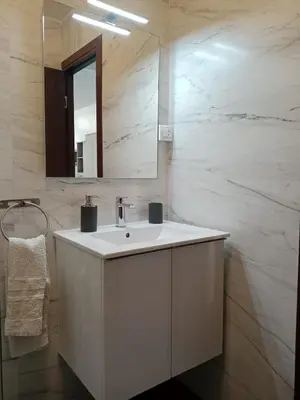 Un baño de Estudio Paraíso piscina y playa
