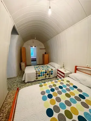 Cama o camas de una habitación en Casa cueva vistas al mar