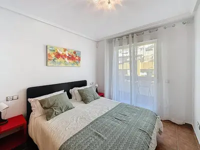 Cama o camas de una habitación en VVR Lomas de Mar Apto con terraza y piscina climatizada