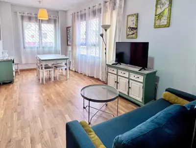 Una televisión o centro de entretenimiento en Apartamentos Arcos Duplex Águilas