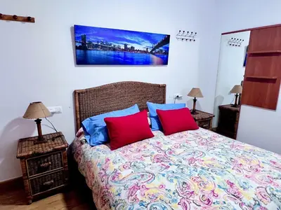 Cama o camas de una habitación en Apartamentos Arcos Céntrico