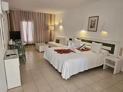 Cama o camas de una habitación en Hotel Puntazo II