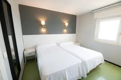 Cama o camas de una habitación en Destinos de Sol Roquetas de Mar - Montepío Minería