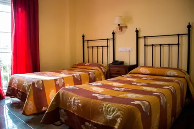 Cama o camas de una habitación en Hostal Restaurante La Curva