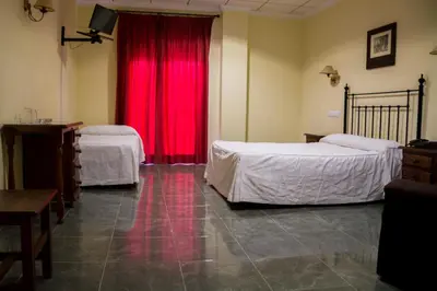 Cama o camas de una habitación en Hostal Restaurante La Curva