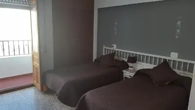 Cama o camas de una habitación en Hospederia Montes