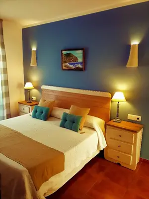 Cama o camas de una habitación en Hotel las Calas