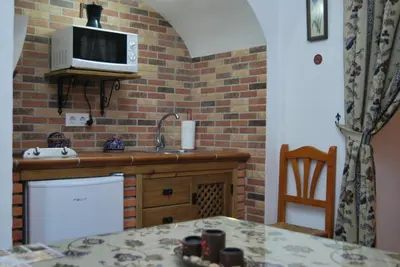 Una cocina o zona de cocina en Cueva El Jaraiz