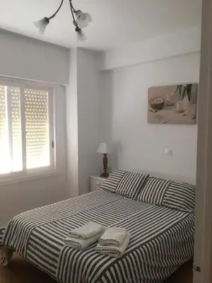 Cama o camas de una habitación en Apartamento a 5 min de la playa y el centro