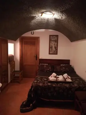 Cama o camas de una habitación en Cueva El Murallon
