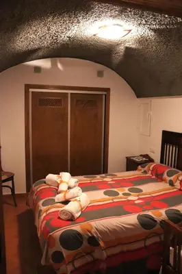Cama o camas de una habitación en Cueva El Murallon