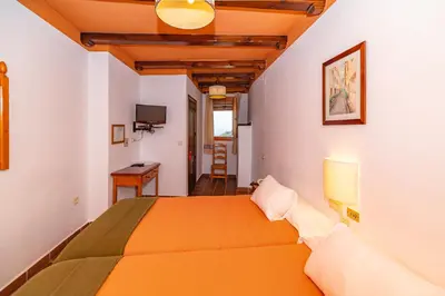 Cama o camas de una habitación en Hotel La Fragua I