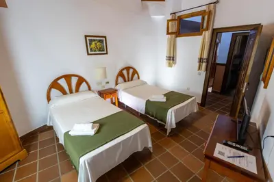 Cama o camas de una habitación en Hotel La Fragua I