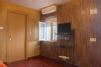 Una televisión o centro de entretenimiento en Vivienda Rural Alba