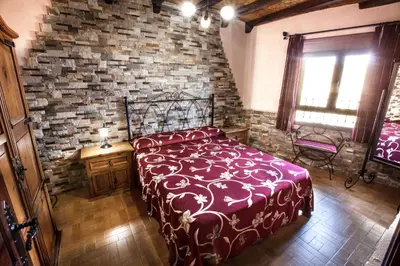 Cama o camas de una habitación en Alojamientos Rurales Benarum con Spa