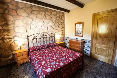 Cama o camas de una habitación en Alojamientos Rurales Benarum con Spa