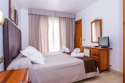 Cama o camas de una habitación en Miramar