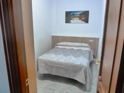 Cama o camas de una habitación en Apartamentos Casa FERMINA - A 2 horas de las pistas de esquí
