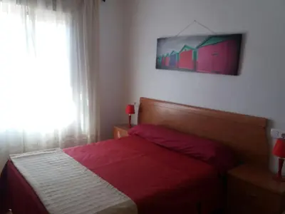 Cama o camas de una habitación en Sol todo el año en Roquetas de Mar