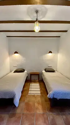 Cama o camas de una habitación en Casas Rurales Cortijo Leontino