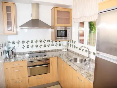 Una cocina o zona de cocina en Apartamentos Turísticos Mirador Del Mar 2A