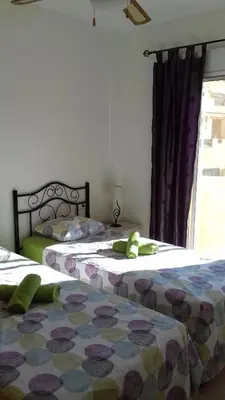 Cama o camas de una habitación en El Faro Puerto Rey