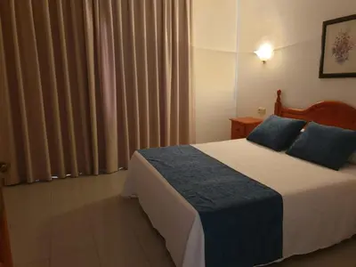 Cama o camas de una habitación en Apartamentos Vera Coast